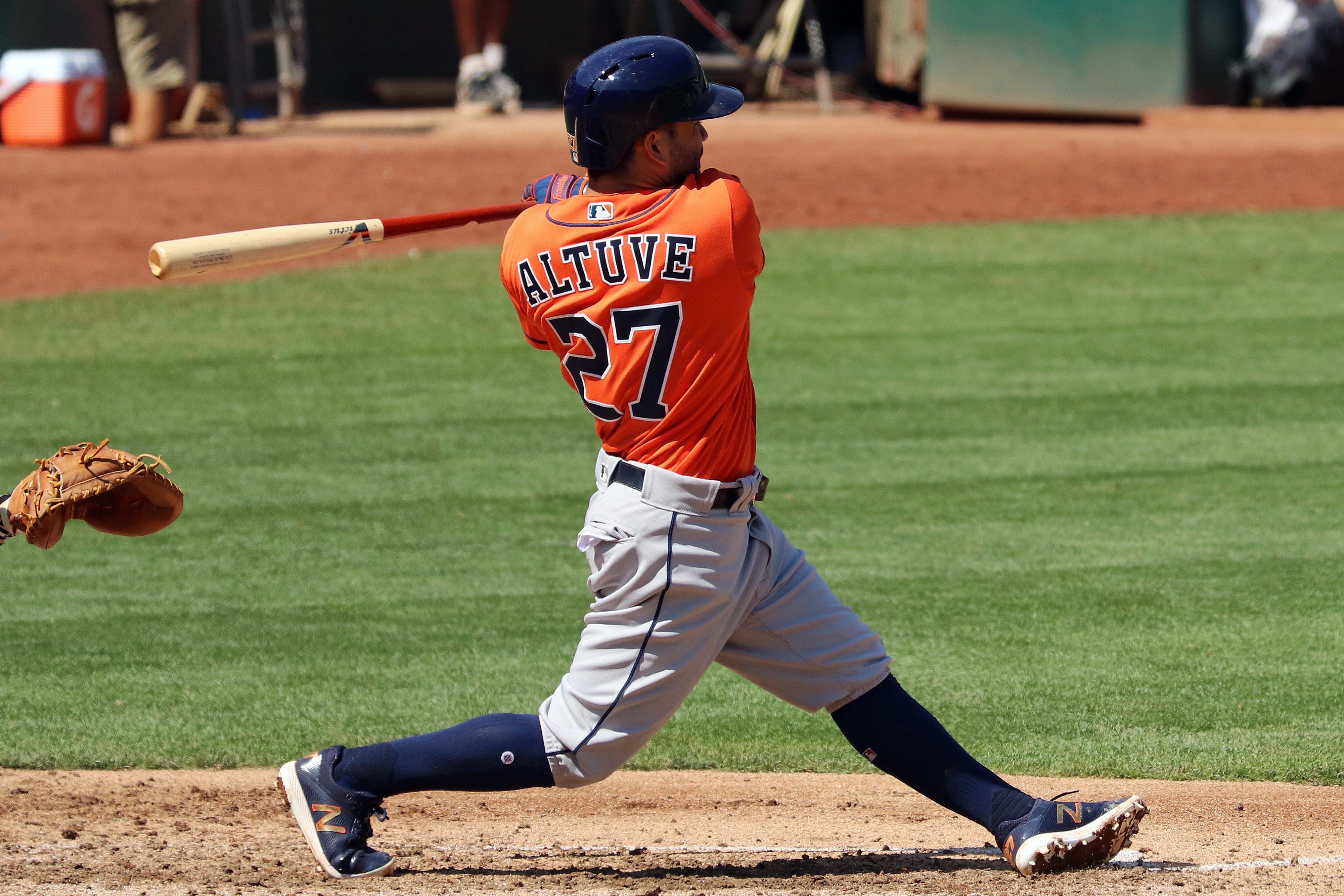 Jose Altuve swings a bat for the Houston Astros. Photo by Jeffrey Hayes.